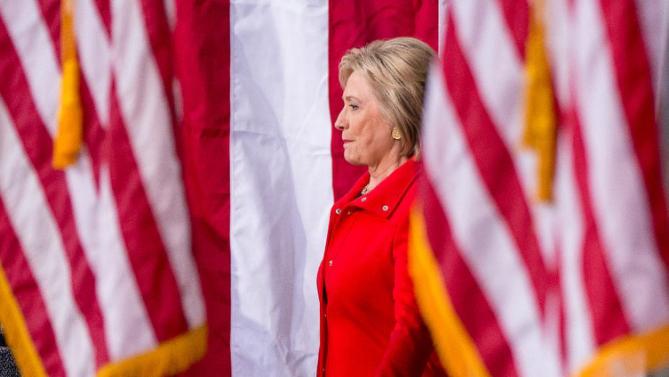Democratic presidential candidate Hillary Clinton, center, arrives for a rally at Iowa State University in Ames, Iowa Saturday, Jan. 30, 2016.  (AP Photo/Andrew Harnik)