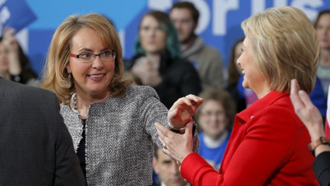 Former U.S. Congresswoman Gabby Giffords (L) introduces U.S. Democratic presidential candidate Hillary Clinton during a "Get Out to Caucus" rally at Iowa State University in Ames, Iowa January 30, 2016.  REUTERS/Brian Snyder