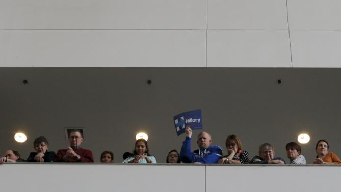 Audience members listen as U.S. Democratic presidential candidate Hillary Clinton speaks during a "Get Out to Caucus" rally at Iowa State University in Ames, Iowa January 30, 2016.  REUTERS/Brian Snyder