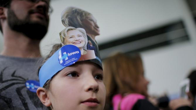 Ten year-old Celia Schrag watches U.S. Democratic presidential candidate Hillary Clinton greet audience members during a "Get Out to Caucus" rally at Iowa State University in Ames, Iowa January 30, 2016.  REUTERS/Brian Snyder