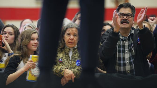 Audience members listen as U.S. Democratic presidential candidate Hillary Clinton speaks during a "Get Out to Caucus" rally in Cedar Rapids, Iowa January 30, 2016.  REUTERS/Brian Snyder