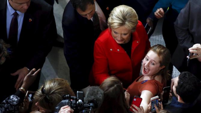A girl reacts as she takes a selfie with U.S. Democratic presidential candidate Hillary Clinton after a campaign rally at Iowa State University in Ames, Iowa January 30, 2016.  REUTERS/Adrees Latif