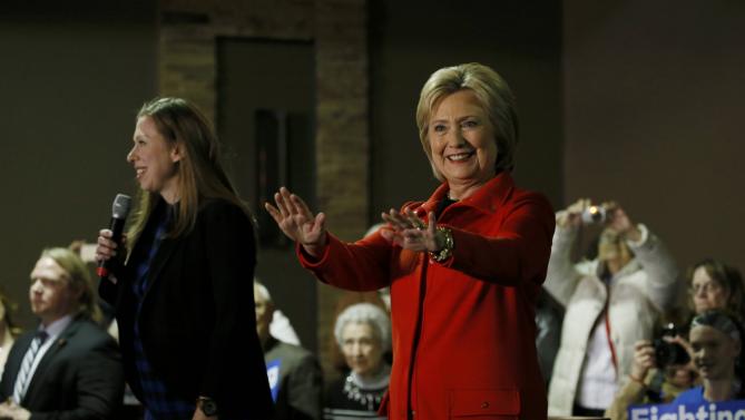 US presidential candidate Hillary Clinton and her daughter Chelsea speak at a campaign event in Carroll, Iowa February 30, 2016. REUTERS/Jim Bourg