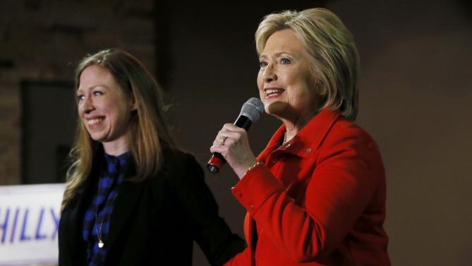 Democratic U.S. presidential candidate Hillary Clinton thanks her daughter Chelsea (L) for introducing her at a campaign event in Carroll, Iowa January 30, 2016. REUTERS/Jim Bourg