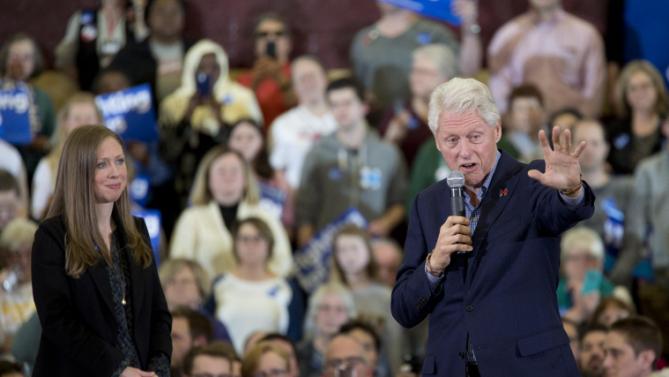 Former President Bill Clinton and daughter Chelsea Clinton introduce Democratic presidential candidate Hillary Clinton speaks during a rally at the Abraham Lincoln High School, Sunday, Jan. 31, 2016, in Des Moines, Iowa. (AP Photo/Mary Altaffer)