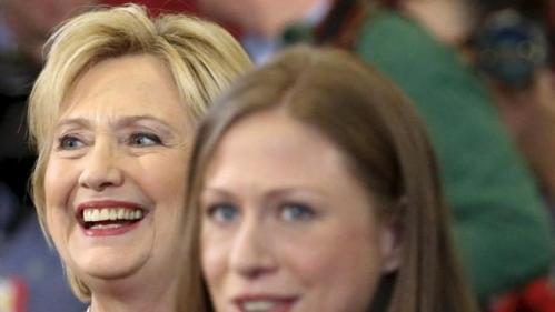 U.S. Democratic presidential candidate Hillary Clinton (L) smiles as she is introduced by her daughter Chelsea Clinton at a campaign rally at Abraham Lincoln High School in Council Bluffs, Iowa January 31, 2016. REUTERS/Adrees Latif
