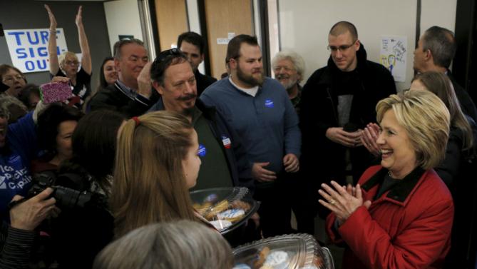 U.S. Democratic presidential candidate Hillary Clinton greets volunteers during a visit to a campaign office in Des Moines, Iowa February 1, 2016, the day of Iowa's first-in-the-nation caucus.    REUTERS/Brian Snyder