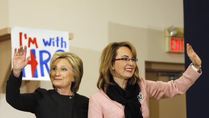 Democratic presidential candidate Hillary Clinton stands with former Arizona Rep. Gabrielle Giffords during a campaign stop, Wednesday, Feb. 3, 2016, in Derry, N.H. (AP Photo/Matt Rourke)