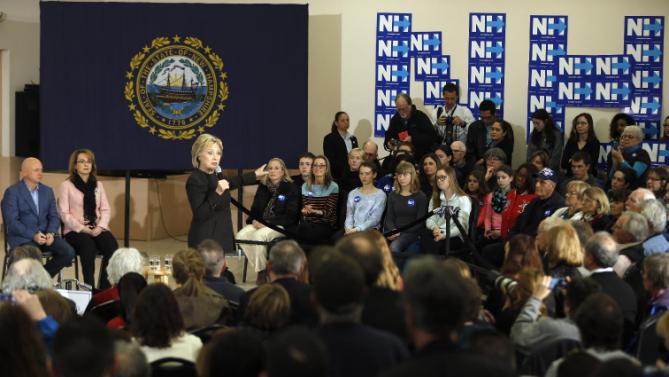 Democratic presidential candidate Hillary Clinton accompanied by former Arizona Rep. Gabrielle Giffords, and her husband astronaut Mark Kelly, speaks during a campaign stop, Wednesday, Feb. 3, 2016, in Derry, N.H. (AP Photo/Matt Rourke)