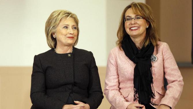 Democratic presidential candidate Hillary Clinton sits with former Arizona Rep. Gabrielle Giffords during a campaign stop Wednesday, Feb. 3, 2016, in Derry, N.H. (AP Photo/Matt Rourke)