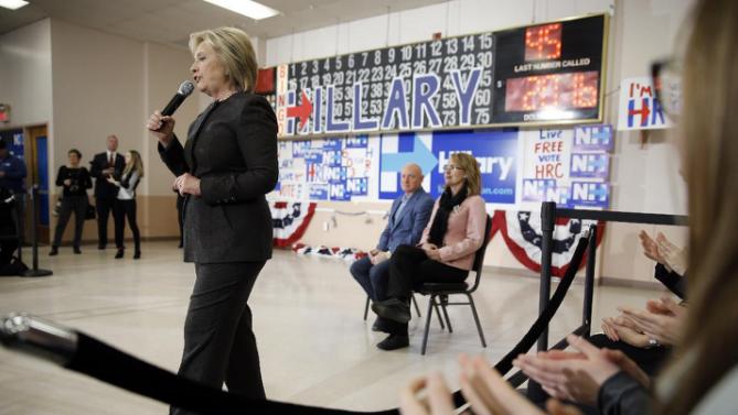 Democratic presidential candidate Hillary Clinton accompanied by former Arizona Rep. Gabrielle Giffords, right, and her husband astronaut Mark Kelly, speaks during a campaign stop, Wednesday, Feb. 3, 2016, in Derry, N.H. (AP Photo/Matt Rourke)