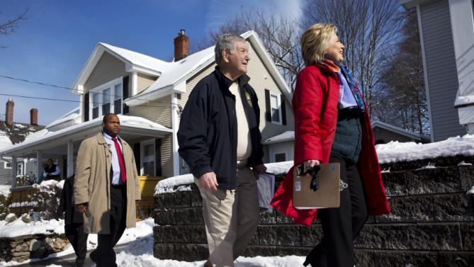 Democratic presidential candidate Hillary Clinton campaigns with New Hampshire Democratic State Sen. Lou D'Allesandro, left, in a neighborhood in Manchester, N.H., Saturday Feb. 6, 2016. (AP Photo/Jacquelyn Martin)