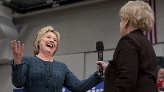 Democratic presidential candidate Hillary Clinton reacts after former Secretary of State Madeleine Albright said, "there’s a special place in hell for women who don’t help each other," while introducing Clinton at a campaign event at Rundlett Middle School, in Concord, N.H., Saturday Feb. 6, 2016. (AP Photo/Jacquelyn Martin)
