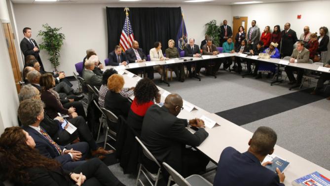 Democratic presidential candidate Hillary Clinton meets with officials at the House Of Prayer Missionary Baptist Church, Sunday, Feb. 7, 2016 in Flint, Mich. (AP Photo/Paul Sancya)