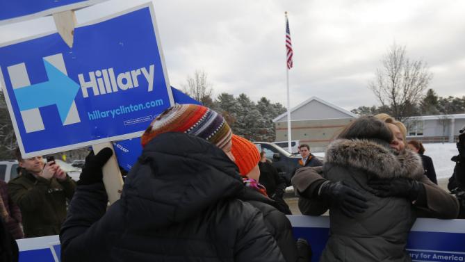 U.S. Democratic presidential candidate Hillary Clinton gets a hug from a supporter outside a polling place in Nashua, New Hampshire February 9, 2016, the day of New Hampshire's first-in-the-nation primary.   REUTERS/Brian Snyder