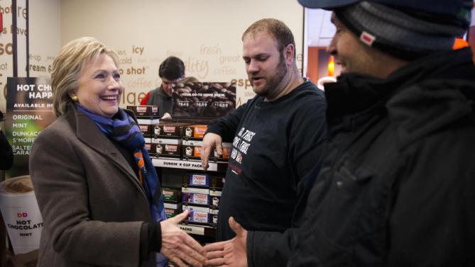 Democratic presidential candidate Hillary Clinton meets with customers as she stops at Dunkin' Donuts during the first-in-the-nation presidential primary, Tuesday, Feb. 9, 2016, in Nashua, N.H. (AP Photo/Matt Rourke)
