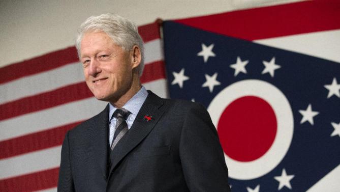 Former President Bill Clinton smiles as he campaigns for his wife, Democratic presidential candidate Hillary Clinton, Friday, Feb. 12, 2016, at the Clifton Cultural Arts Center in Cincinnati. (AP Photo/John Minchillo)