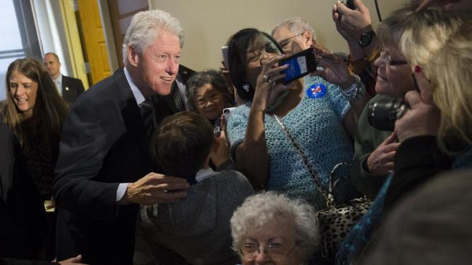 Former President Bill Clinton meets with attendees as he campaigns for his wife, Democratic presidential candidate Hillary Clinton, at the Clifton Cultural Arts Center, Friday, Feb. 12, 2016, in Cincinnati. (AP Photo/John Minchillo)