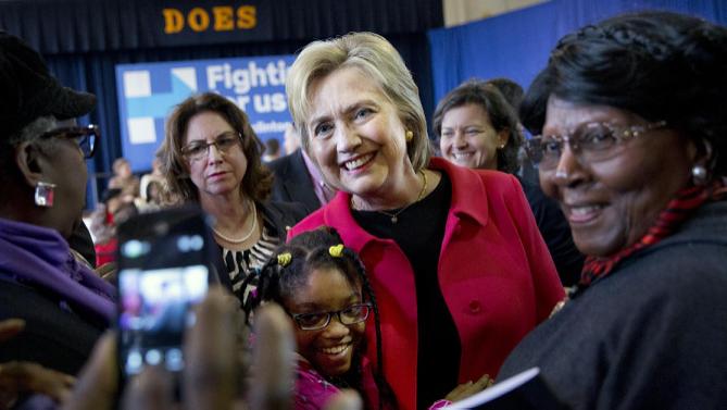 Democratic presidential candidate Hillary Clinton takes a photograph with Jordan Daniels, 11, of Denmark, S.C., during a town hall meeting at Denmark Olar Elementary School in Denmark, S.C., Friday Feb. 12, 2016. (AP Photo/Jacquelyn Martin)