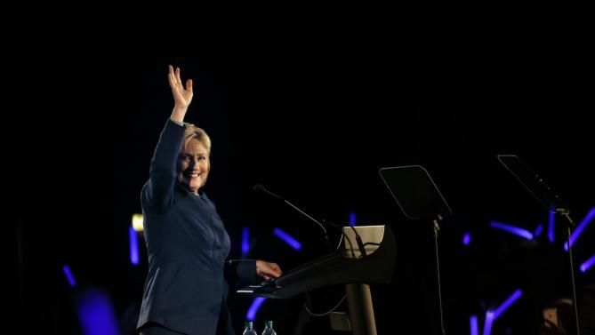 Democratic presidential candidate Hillary Clinton waves before speaking to guests at the Colorado Democrats 83rd Annual Dinner, in Denver, Saturday, Feb. 13, 2016. (AP Photo/Brennan Linsley)