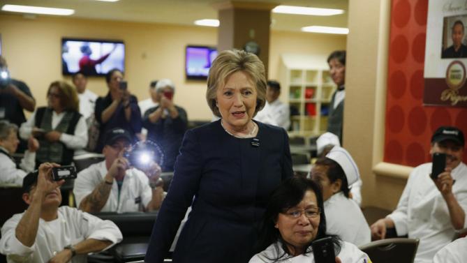 Democratic presidential candidate Hillary Clinton meets with employees of Harrah's Las Vegas during a visit to the casino, Saturday, Feb. 13, 2016, in Las Vegas. (AP Photo/John Locher)