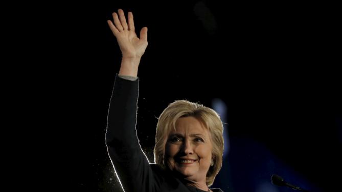 U.S. Democratic presidential candidate Hillary Clinton waves to the audience at the Jefferson-Jackson dinner in Denver, Colorado, United States, February 13, 2016.   REUTERS/Jim Young