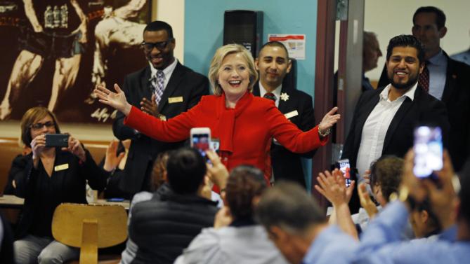 Democratic presidential candidate Hillary Clinton speaks with employees of Caesars Palace during a visit to the casino Sunday, Feb. 14, 2016, in Las Vegas. (AP Photo/John Locher)