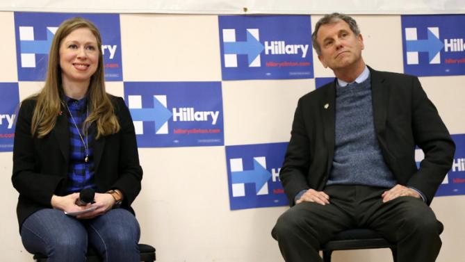 Chelsea Clinton, left, sits alongside U.S. Sen. Sherrod Brown, D-Ohio, as she speaks at the Murtis H. Taylor Community Center, Monday, Feb. 15, 2016, in Cleveland. Clinton made a campaign stop for her mother, Democratic presidential candidate Hillary Clinton, to talk with voters.  (AP Photo/Aaron Josefczyk)
