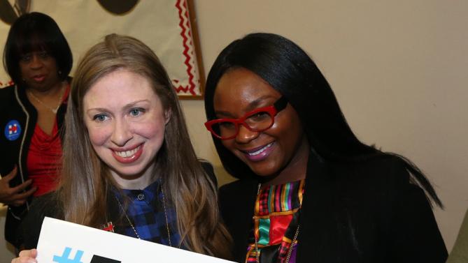 Chelsea Clinton, left, poses for a photo with Kevinee Gilmore after speaking at the Murtis H. Taylor Community Center, Monday, Feb. 15, 2016, in Cleveland. Clinton made the campaign stop for her mother, Democratic presidential candidate Hillary Clinton, to talk with voters. (AP Photo/Aaron Josefczyk)