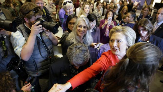 Democratic presidential candidate Hillary Clinton, right, shakes hands with supporters after participating in a women's health discussion at the University of Nevada on Monday, Feb. 15, 2016, in Reno, Nev. (AP Photo/Marcio Jose Sanchez)