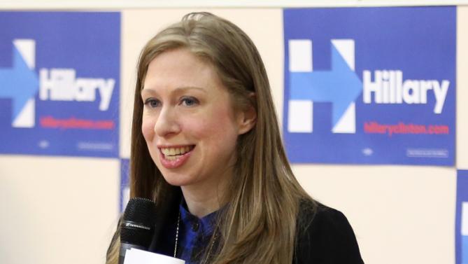 Chelsea Clinton places her hand on her stomach as speaks at the Murtis H. Taylor Community Center Monday, Feb. 15, 2016, in Cleveland. Clinton made a campaign stop for her mother, Democratic presidential candidate Hillary Clinton, to talk with voters.  (AP Photo/Aaron Josefczyk)