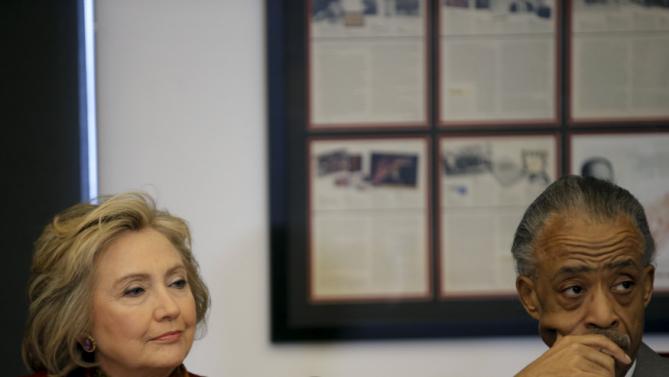 Democratic U.S. presidential candidate Hillary Clinton (L) sits with The Reverend Al Sharpton, Founder and President of the National Action Network, as she meets with civil rights leaders at the National Urban League in the Manhattan borough of New York City, February 16, 2016.  REUTERS/Mike Segar