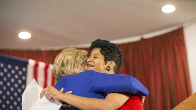 Democratic presidential candidate Hillary Clinton hugs Geneva Reed-Veal, mother of Sandra Bland, at a rally at Parkway Ballroom in Chicago, Illinois on February 17, 2016. REUTERS/Alex Wroblewski