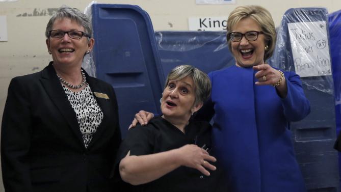 U.S. Democratic presidential candidate Hillary Clinton shares a laugh with workers in the linen room at Caesar's Palace during a campaign stop in Las Vegas, Nevada, United States, February 18, 2016. REUTERS/Jim Young