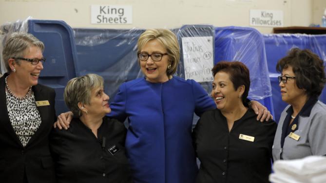 U.S. Democratic presidential candidate Hillary Clinton speaks to workers in the linen room at Caesar's Palace during a campaign stop in Las Vegas, Nevada, United States, February 18, 2016. REUTERS/Jim Young