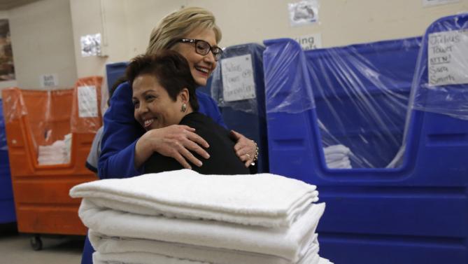 U.S. Democratic presidential candidate Hillary Clinton hugs linen room worker Miriam Deleon during a campaign stop at Caesar's Palace in Las Vegas, Nevada, United States, February 18, 2016. REUTERS/Jim Young