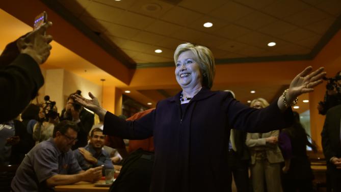 U.S. Democratic presidential candidate Hillary Clinton smiles for a photos as she greets workers in the employee dinning room at the Rio Hotel and Casino in Las Vegas, Nevada February 18, 2016. REUTERS/David Becker