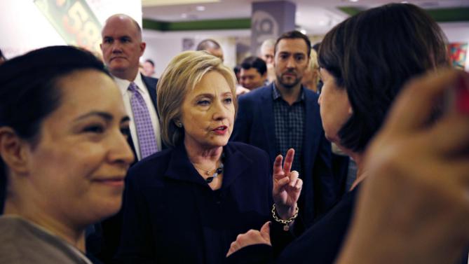 Democratic presidential candidate Hillary Clinton speaks with an MGM Grand employee during a visit to the hotel and casino Thursday, Feb. 18, 2016, in Las Vegas. (AP Photo/John Locher)