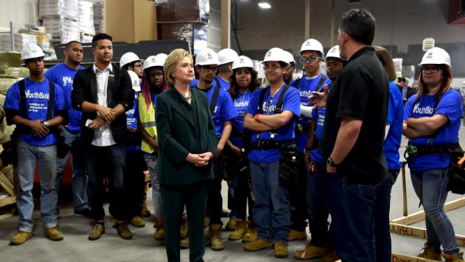 U.S. Democratic presidential candidate Hillary Clinton meets people while visiting YouthBuild, a non-profit organization which provides education, counseling and job skills to unemployed young adults in Las Vegas, Nevada February 19, 2016. REUTERS/David Becker