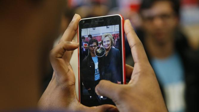 Democratic presidential candidate Hillary Clinton poses for a photo at Del Sol High School, Friday, Feb. 19, 2016, in Las Vegas. (AP Photo/John Locher)