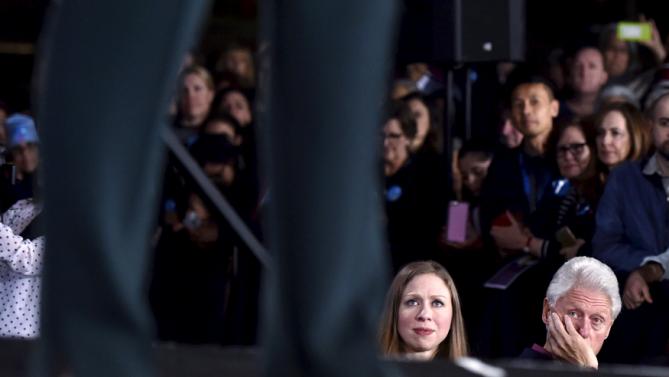 Chelsea Clinton and her father, former President Bill Clinton look on as U.S. Democratic presidential candidate Hillary Clinton speaks at a campaign rally at the Clark County Government Center in Las Vegas, Nevada, February 19, 2016. REUTERS/David Becker TPX IMAGES OF THE DAY