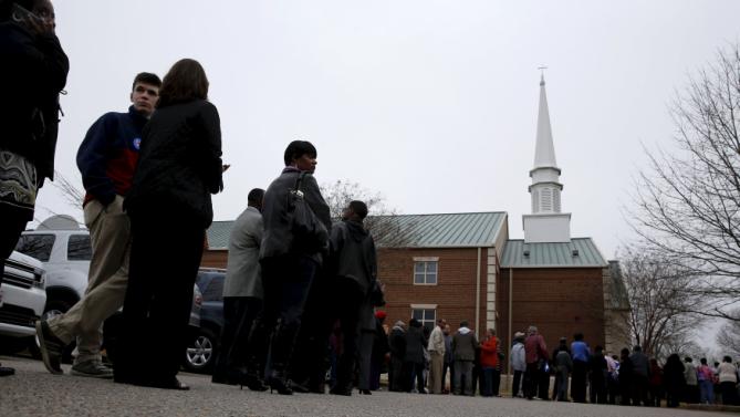 People wait in line to take part in a town hall meeting with U.S. Democratic presidential candidate Hillary Clinton at Central Baptist Church in Columbia, South Carolina February 23, 2016. REUTERS/Jonathan Ernst