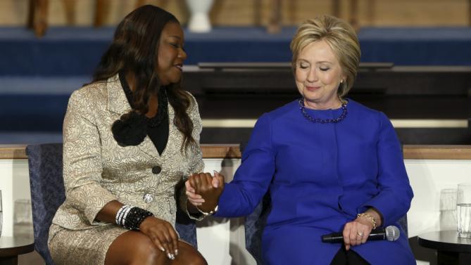 Sybrina Fulton (L), mother of shooting victim Trayvon Martin, endorses U.S. Democratic presidential candidate Hillary Clinton during a town hall meeting at Central Baptist Church in Columbia, South Carolina February 23, 2016.  REUTERS/Jonathan Ernst      TPX IMAGES OF THE DAY