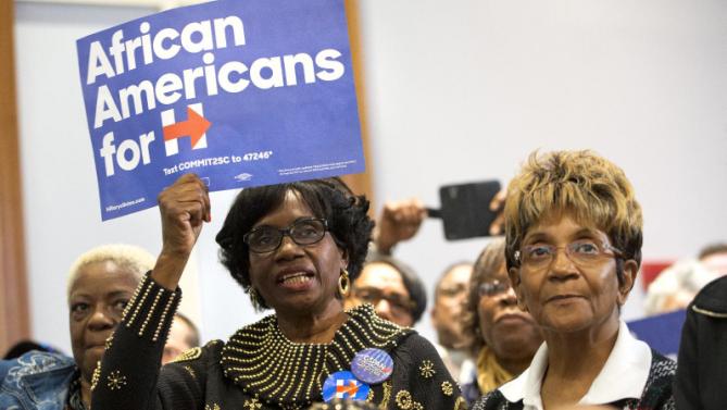 Women cheer during a rally for Democratic presidential candidate Hillary Clinton at the Central Baptist Church in Columbia, S.C., on Tuesday, Feb. 23, 2016. (AP Photo/Jacquelyn Martin)