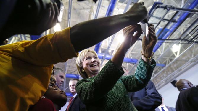 Democratic presidential candidate Hillary Clinton poses for photos with audience members after speaking at a campaign event at Morris College in Sumter, S.C., Wednesday, Feb. 24, 2016. (AP Photo/Gerald Herbert)
