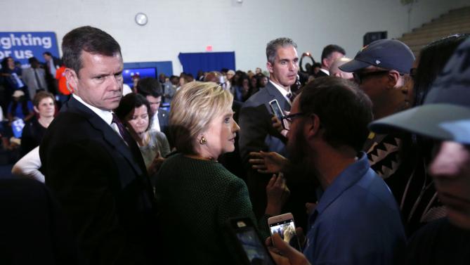 Secret Service agents escort Democratic presidential candidate Hillary Clinton as she greets supporters after speaking at a campaign event at Morris College in Sumter, S.C., Wednesday, Feb. 24, 2016. (AP Photo/Gerald Herbert)