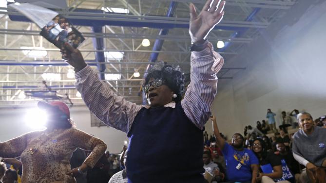 A supporter cheers as Democratic presidential candidate Hillary Clinton speaks at a campaign event at Morris College in Sumter, S.C., Wednesday, Feb. 24, 2016. (AP Photo/Gerald Herbert)