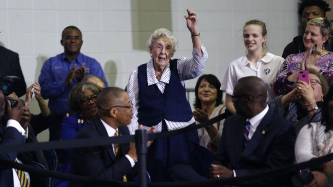 Mary Cunningham, 102 years old, waves as she is acknowledged by Democratic presidential candidate Hillary Clinton during a campaign speech at Morris College in Sumter, S.C., Wednesday, Feb. 24, 2016. (AP Photo/Gerald Herbert)