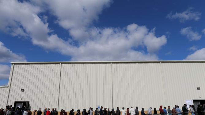 People line up for a town hall rally for U.S. Democratic presidential candidate Hillary Clinton at the Williamsburg County Recreation Center in Kingstree, South Carolina, February 25, 2016. REUTERS/Randall Hill