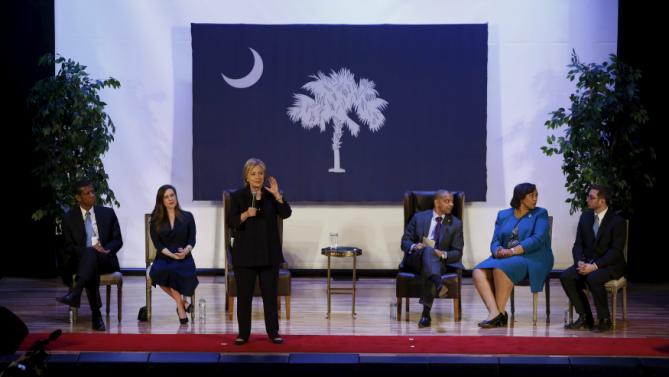 U.S. Democratic presidential candidate Hillary Clinton, onstage with local officials, speaks at a town hall meeting for supporters at Royal Baptist Church Family Life Center in North Charleston, South Carolina February 25, 2016. REUTERS/Jonathan Ernst